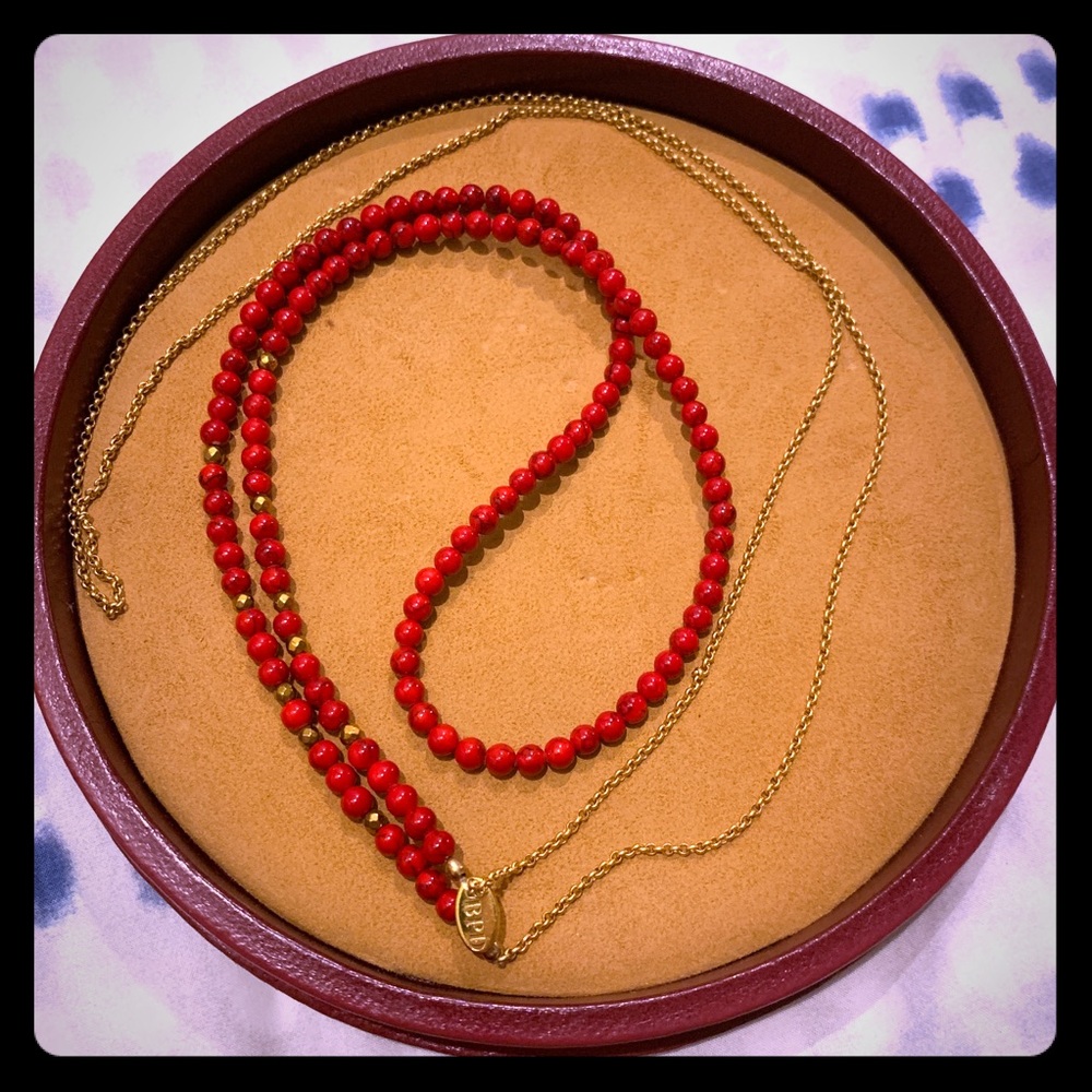 Long red beaded necklace